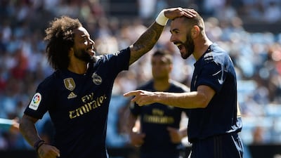 Marcelo celebrates with Karim Benzema after the striker scored Real Madrid's first goal. AFP
