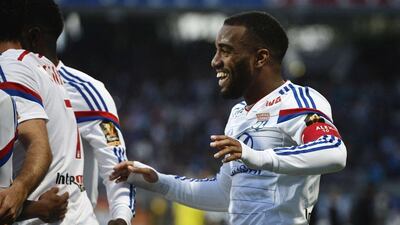 Lyon's Alexandre Lacazette celebrates after scoring in his side's Ligue 1 win over Bastia on Wednesday. Jeff Pachoud / AFP / April 15, 2015
