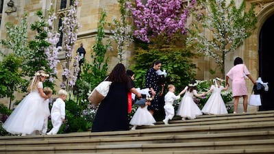 Pageboys and bridesmaids arrive at St George's Chapel for the wedding. AFP