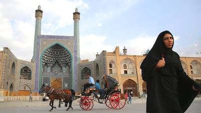 People ride a horse and carriage in Isfahan’s Unesco-listed central square. Isfahan, with its immense mosques, picturesque bridges and ancient bazaar, is a virtual living museum of Iranian traditional culture, and is Iran’s top tourist destination. John Moore / Getty Images