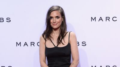 Winona Ryder in a strappy black dress attends the Marc Jacobs Spring 2016 fashion show during New York Fashion Week at Ziegfeld Theater on September 17, 2015. Getty