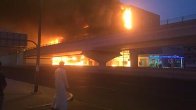 As the evening wore on, black smoke filling the air, nearby roads remained cordoned off as police warned the public against taking photos or filming the fire on their camera phones. Photo courtesy @sandierpastures via Twitter