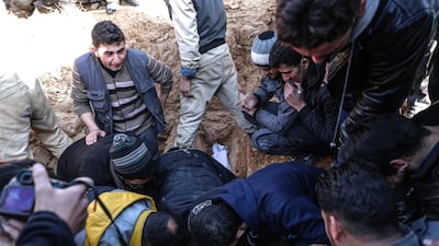 Volunteers of the White Helmets react during the funeral of a killed colleague named 28-years old Mohammed Buidany, who died during his job earlier in the day, after shelling on Douma, Syria. Mohammed Badra/ EPA