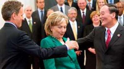 Timothy Geithner, left, the US Treasury secretary, Hillary Clinton, the US secretary of state, and Wang Qishan, the Chinese vice premier, meet in Beijing yesterday before the start of the second round of the US-China Strategic and Economic Dialogue.