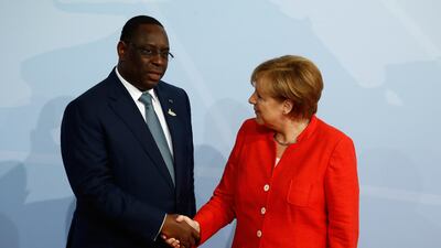 With Senegalese president Macky Sall. Odd Andersen / AFP Photo