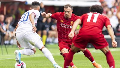 Liverpool's Xherdan Shaqiri looks to win the ball. EPA