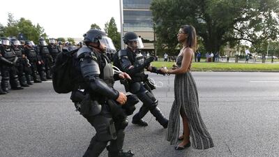 A demonstrator protesting the shooting death of Alton Sterling is detained by law enforcement in Baton Rouge, Louisiana. Jonathan Bachman / Reuters