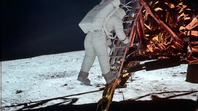 Buzz Aldrin descends a ladder onto the lunar surface during the Apollo 11 mission. NASA / AP