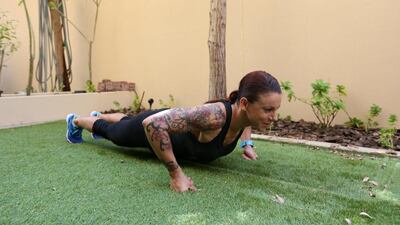 The most knuckle push ups in one hour by a female: Eva Clarke did 1,206 push ups at Wahda Mall, in Abu Dhabi. Fatima Al Marzooqi / The National.