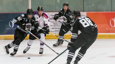 Tthe Dubai Mighty Camels, in black, took revenge against Al Ain Theebs in the EHL play-off final after losing twice in the regular season. Navin Khianey / The National