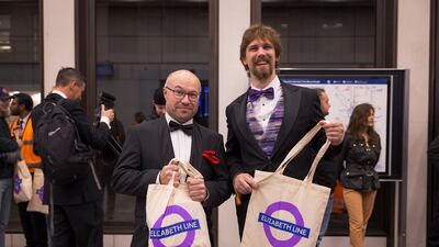 Passengers hold Elizabeth Line branded bags at Bond Street. TFL