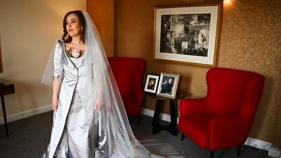 Stella Moris poses in her wedding dress. PA