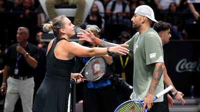 Nick Kyrgios greets Aryna Sabalenka after victory in the Battle of the Sexes exhibition match at the Coca-Cola Arena in Dubai. PA