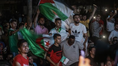 Palestinians supporters of the Algerian team celebrate in Gaza City. EPA
