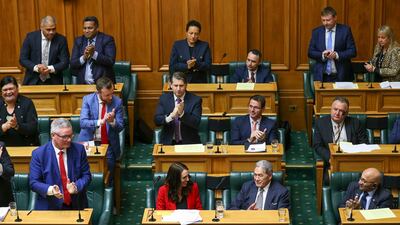 Prime Minister Jacinda Ardern is applauded by colleagues after making an adjournment speech at Parliament. Getty
