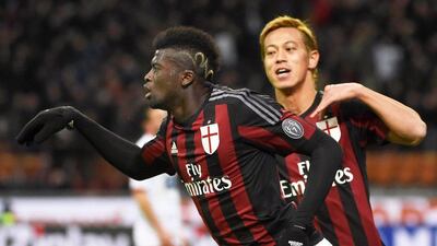 AC Milan's M'Baye Niang, left, celebrates with his teammate Keisuke Honda after scoring the 2-0 lead during the Italian Cup quarter final between AC Milan and Carpi FC at the Giuseppe Meazza stadium in Milan, Italy, 13 January 2016. EPA/DANIEL DAL ZENNARO