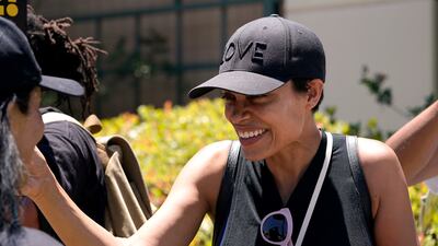 Rosario Dawson attends a rally held by striking writers and actors outside Warner Bros studios in Burbank, California. AP