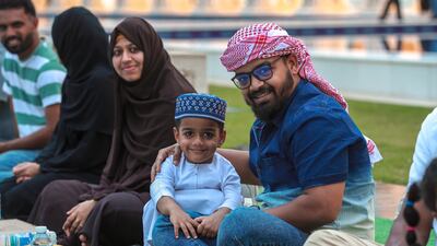 Worshippers wait for the start of iftar at the mosque. Victor Besa / The National
