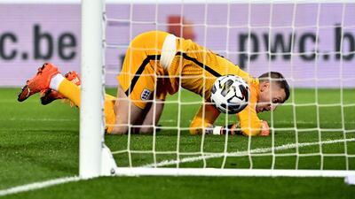 England goalkeeper Jordan Pickford fails to stop a free kick from Belgium's Dries Mertens. PA