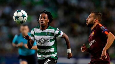 Sporting's Gelson Martins vies with Barcelona's Jordi Alba. Jose Manuel Ribeiro / AFP