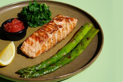 Salmon comes grilled or crusted with pistachio. Photo: Krave Abu Dhabi