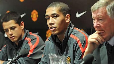 Manchester United manager Sir Alex Ferguson with Javier Hernandez, left, and Chris Smalling.