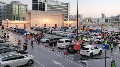 The drive-in cinema is making a comeback at Mall Of The Emirates, and a large screen has been assembled in the shopping centre's upper parking lot, on level 3, right underneath Ski Dubai's slope. Patrons take position, switch off their engines and settle in for the film. Reem Mohammed / The National