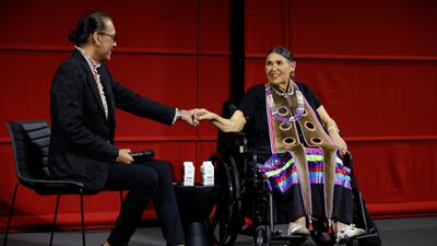 Bird Runningwater, left, co-chair of the Academy's Indigenous Alliance on stage with Littlefeather at Ampas Presents An Evening with Sacheen Littlefeather at Academy Museum of Motion Pictures on September 17, 2022 in Los Angeles, California. AFP