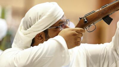 Visitor look at guns on sale at the Bynuna stand. Pawan Singh / The National