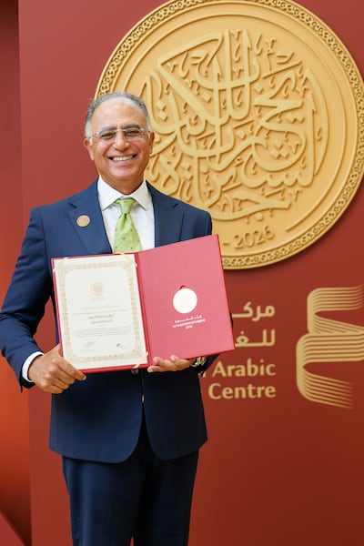 Egyptian novelist Ashraf Elashmawy with his 2026 Sheikh Zayed Book Award for Literature, which he won for Births in the Zoo. Photo: Abu Dhabi Arabic Language Centre
