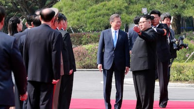 The leaders get ready to inspect a honour guard Korea Summit Press Pool via AP