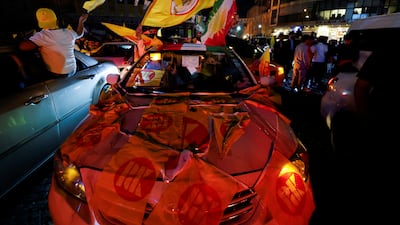 Supporters of the Kurdistan Democratic Party celebrate after polls close in the Kurdish region. Reuters