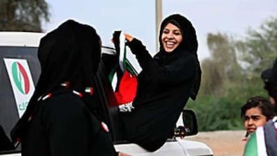 Huda Al Gabree celebrates the UAE's 37th anniversary in Fujairah. She was part of a group of eight Emirati women who participated in a National Day drive through all seven Emirates to raise awareness of breast cancer.