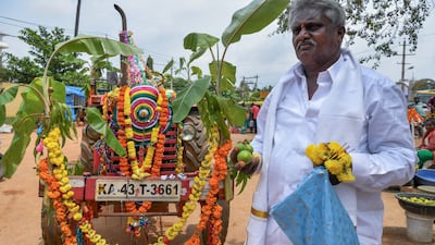 A Hindu devotee parks his decorated tractor outside a temple amid Dussehra celebrations in Bangalore. AFP