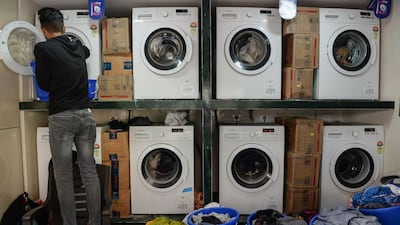 While washers and dryers arguably have wheels, they definitely have doors. AFP