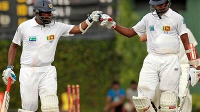 Sri Lanka's Thilan Samaraweera and Suraj Randiv celebrate against New Zealand in Colombo.