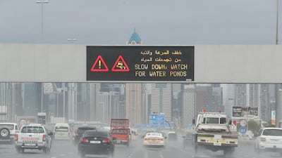 Traffic moved slowly on Al Khail road because of heavy rain. Pawan Singh / The National