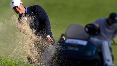 Tiger Woods hits out of the sand during a US Open warm-up practice round at the Olympic Club.