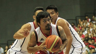 Manny Pacquiao drives to the hoop dring Kia-Sorento's PBA game against Blackwater-Elite on Sunday during the first quarter in Bocaue, a town north of Manila. Romeo Ranoco / Reuters
