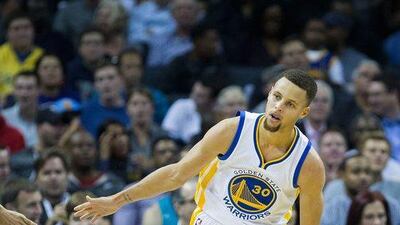 Stephen Curry of the Golden State Warriors celebrates during his team's win over the Charlotte Hornets in the NBA on Wednesday night. Brian A Westerholt / Getty Images / AFP / December 2, 2015