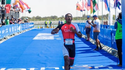 Special Olympics ITU Traiathlon at the YAS Marina Circuit. Jonah Hambleton cross the finish line at the triathlon. Victor Besa / The National