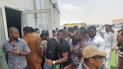 People queue to enter a Visa Amnesty Centre in Al Awir, Dubai. Satish Kumar for The National