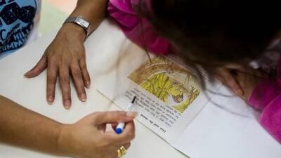 A pupil at the Future Centre School, a special-needs institution in Abu Dhabi, takes part in a reading lesson.