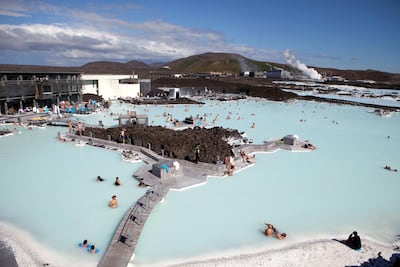 Looking down at locals and tourists in the thermal pools at the Blue Lagoon Spa just outside of Reykjavik, Iceland. Iceland is one of the most isolated countries at the world and has been drawing adventure tourists for years and continues to be one of the most visually stunning places in the world. (Photo by Ryan Pyle/Corbis via Getty Images)