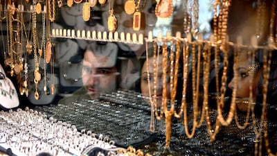 Iranians shop for gold in Tehran. Demand for the precious metal rose 40 per cent in the third quarter. Newsha Tavakolian For The National