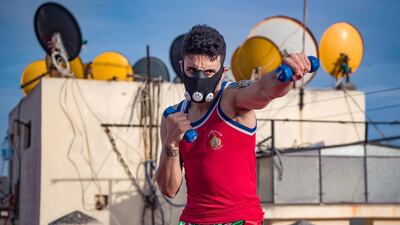 Zakaria Bouamama, a Moroccan professional Muay Thai coach and fighter, trains on the rooftop of a building in Rabat. AFP