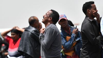 Distraught relatives of the victims react at the crash site. AFP
