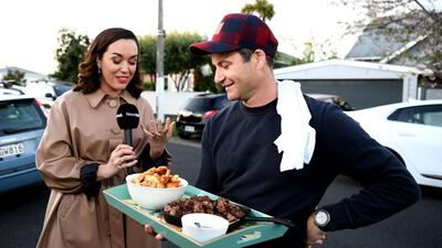 New Zealand Labour Party leader Jacinda Ardern's partner Clarke Gayford delivers home cooked food to the media waiting outside their house. Getty Images