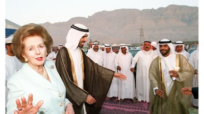 British former Prime Minister Baroness Margaret Thatcher, left, walks alongside Sheikh Faisal Bin Saqr Al Qasimi in Ras Al Khaimah on March 24, 1998. AFP