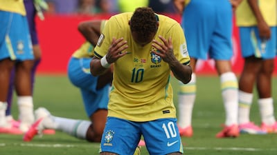Brazil forward Neymar slumps to his knees as the final whistle is blown. AFP